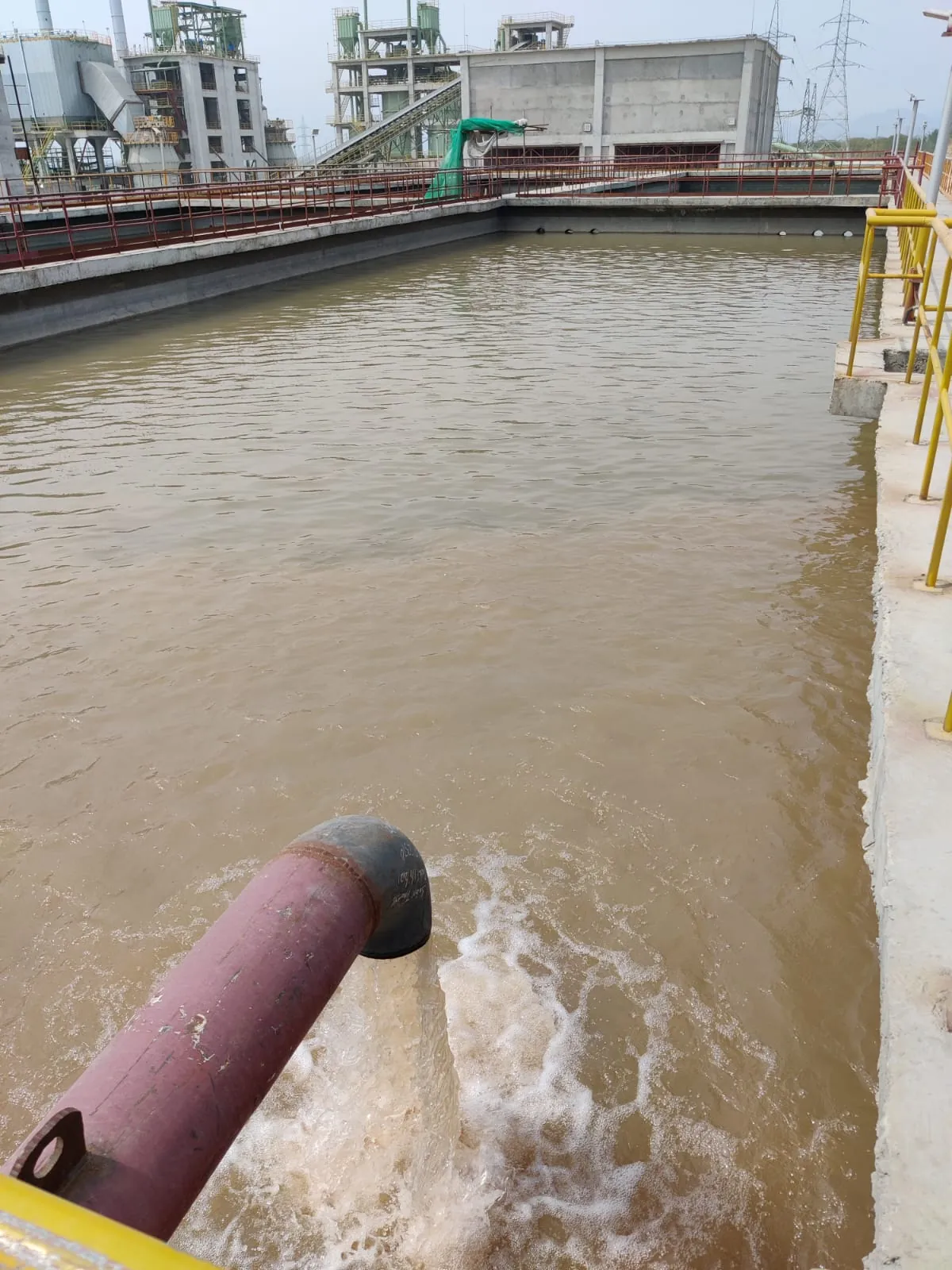 Raw canal water entering the settling basin
